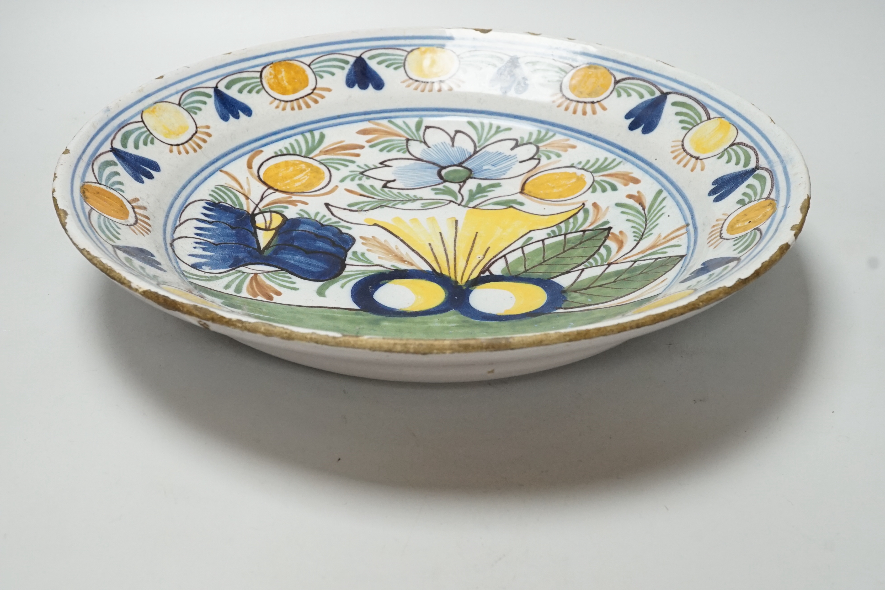 An 18th century Delftware charger, 35cm diameter